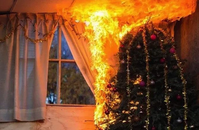 christmas tree on fire in a home